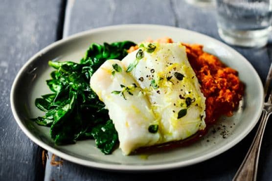 Herb & garlic baked cod with romesco sauce & spinach