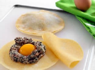 Raviolo with Egg Yolk in Truffle Scented Sage Brown Butter Sauce
