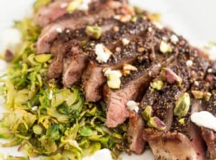 Crusted Strip Steak over Warm Shaved Brussels Sprouts