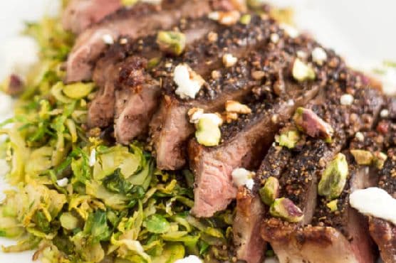 Crusted Strip Steak over Warm Shaved Brussels Sprouts