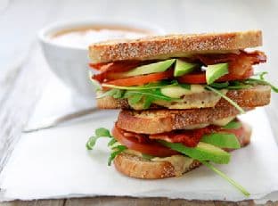Grilled Cheese With Tomato, Avocado, Bacon, And Arugula